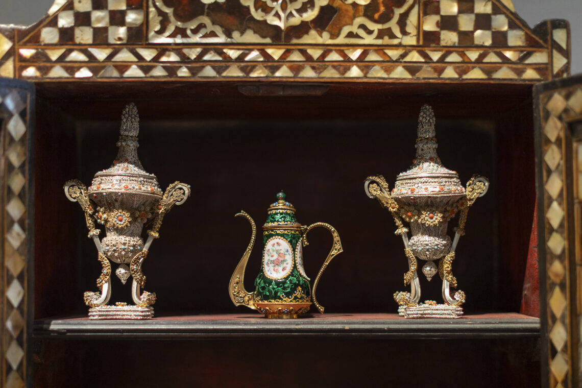 Cabinet with antiques inside